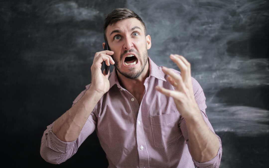 man on phone frustrated